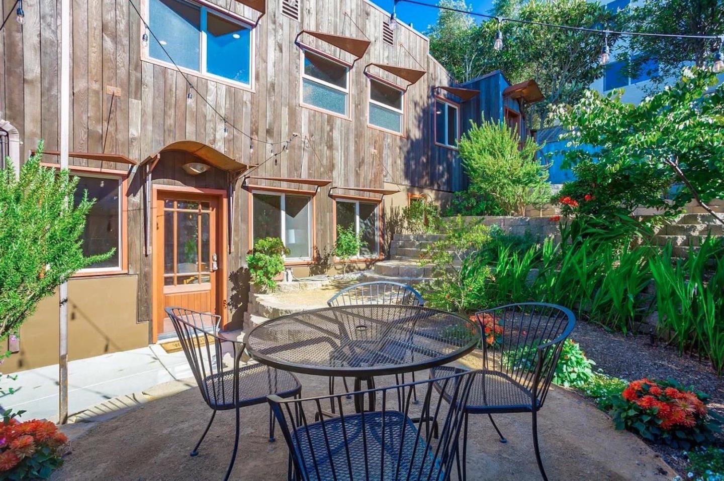 280 San Benito Road Brisbane, CA 94005 - Photo 38 of 63 a view of a chair and table in backyard of the house
