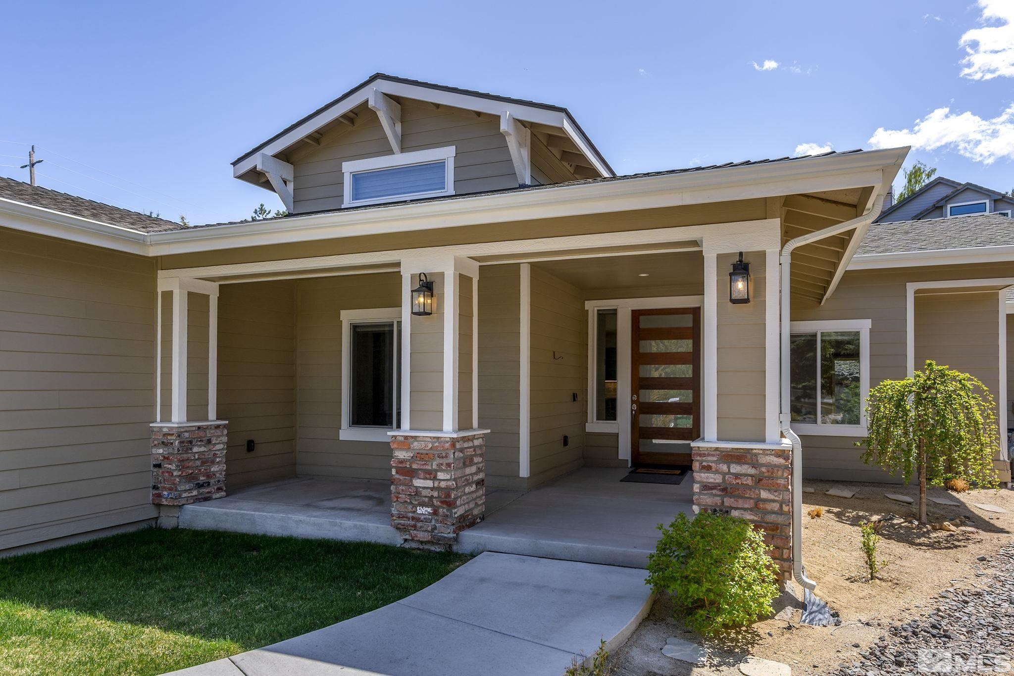 3880 Royer Court Reno, NV 89509 - Photo 2 of 29 a front view of a house with a yard