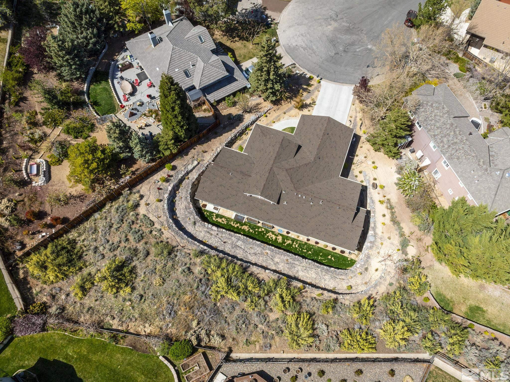 3880 Royer Court Reno, NV 89509 - Photo 27 of 29 view of a wooden house with large trees
