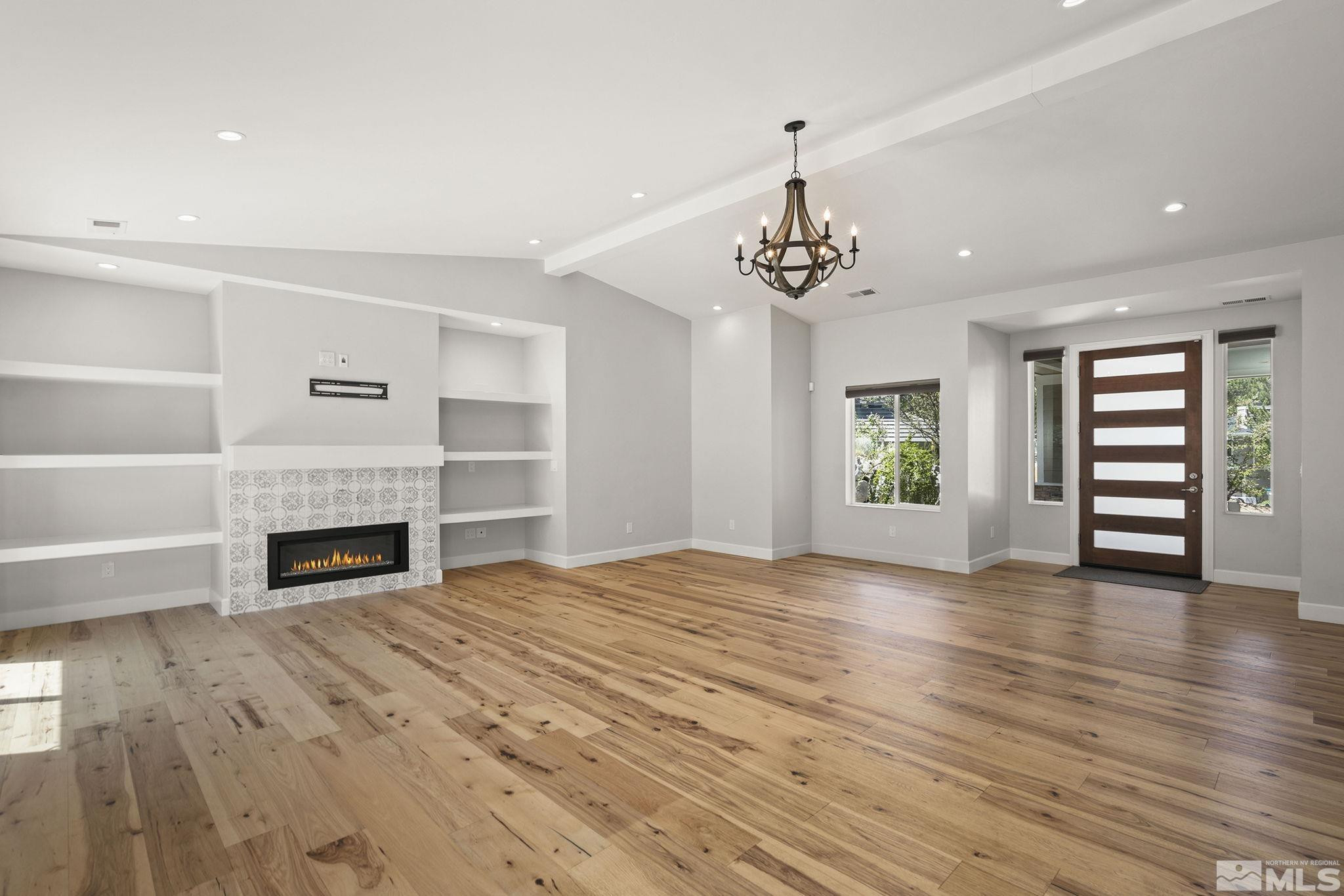 3880 Royer Court Reno, NV 89509 - Photo 9 of 29 a view of a room with wooden floor fireplace and window