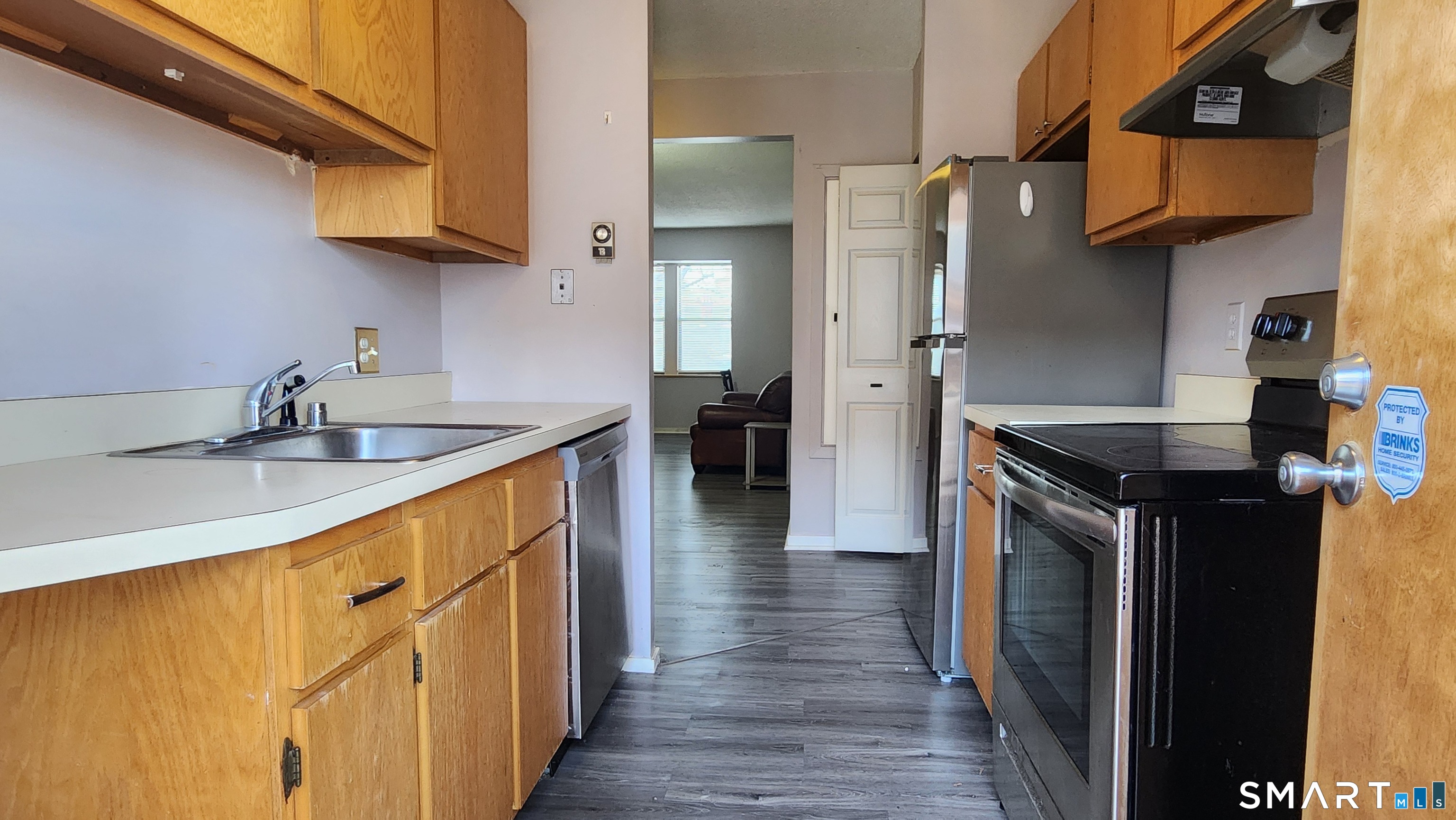 18 Townley Street, Unit D3 Hartford, CT 06105 - Photo 4 of 10 a kitchen with stainless steel appliances granite countertop a sink and a refrigerator