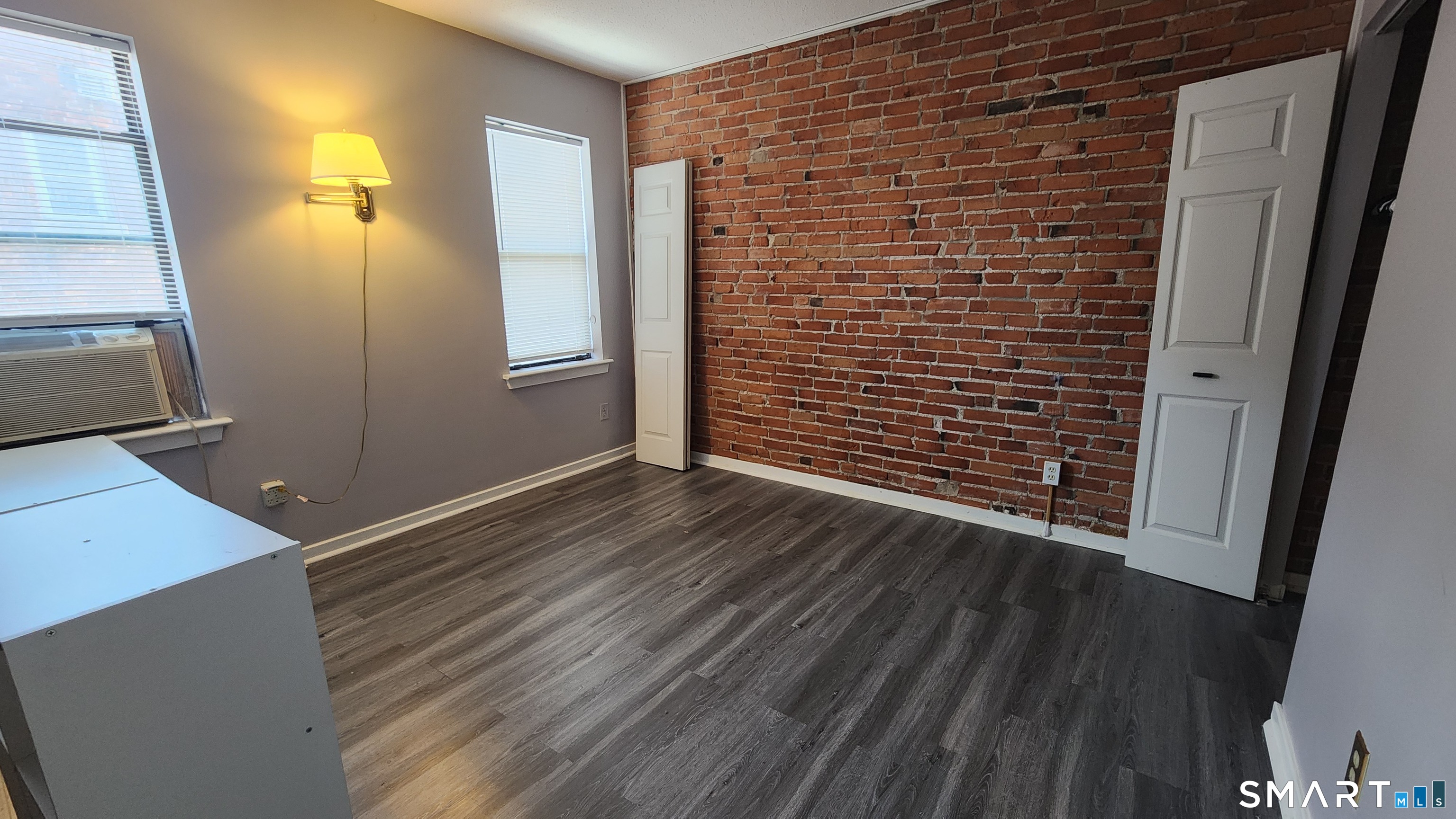 18 Townley Street, Unit D3 Hartford, CT 06105 - Photo 7 of 10 a view of a hallway with wooden floor and staircase