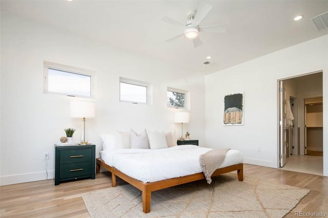 a bedroom with a bed and a table