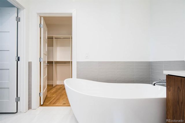 a white bath tub sitting in a bathroom