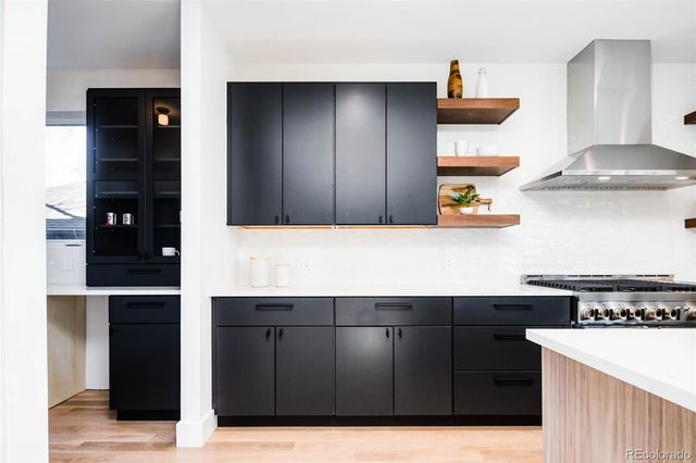 a kitchen with a sink and cabinets
