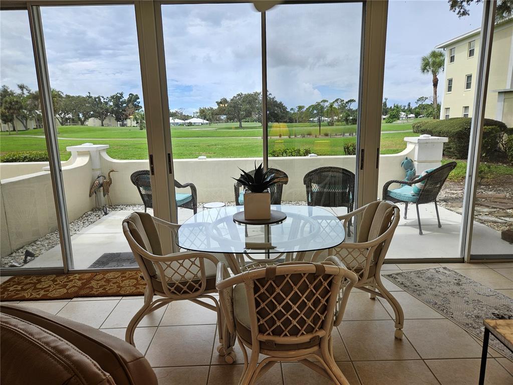 435 Cerromar Lane, Unit 329 Venice, FL 34293 - Photo 11 of 57 a view of a dining room with furniture window and outside view