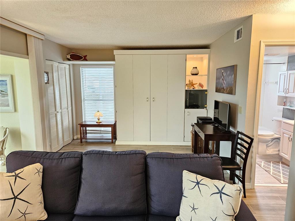 435 Cerromar Lane, Unit 329 Venice, FL 34293 - Photo 17 of 57 a living room with furniture and a window
