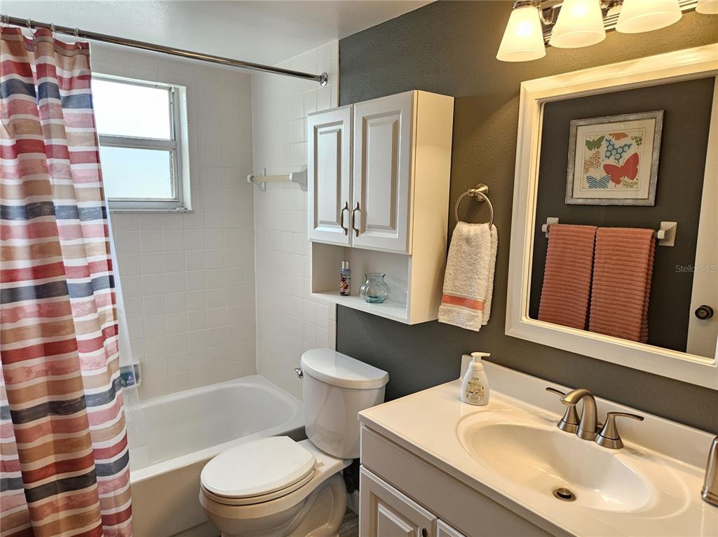 435 Cerromar Lane, Unit 329 Venice, FL 34293 - Photo 22 of 57 a bathroom with a sink toilet and shower