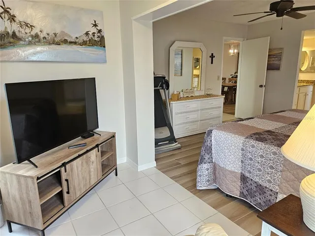 a bathroom with a granite countertop sink mirror vanity and toilet