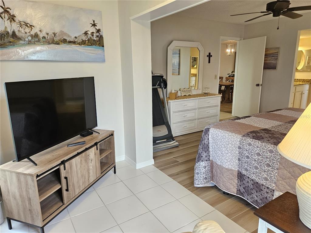 435 Cerromar Lane, Unit 329 Venice, FL 34293 - Photo 44 of 57 a living room with furniture and a flat screen tv