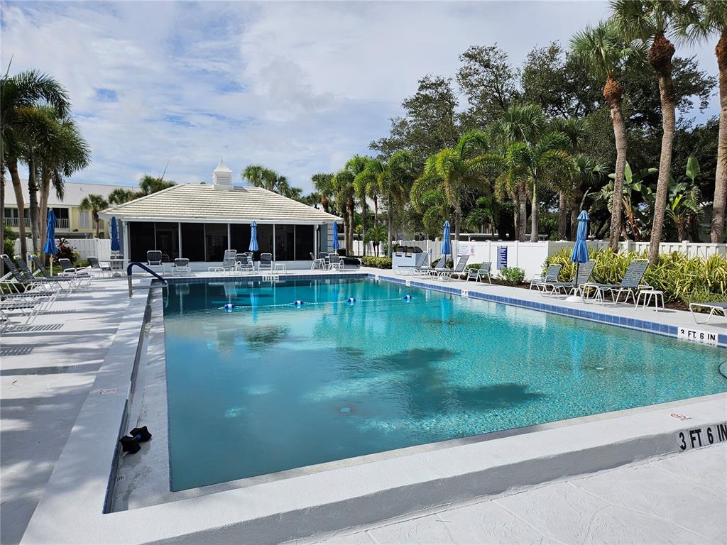 435 Cerromar Lane, Unit 329 Venice, FL 34293 - Photo 54 of 57 a view of a swimming pool with a patio