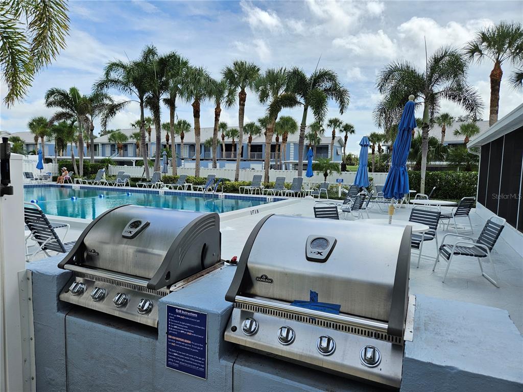 435 Cerromar Lane, Unit 329 Venice, FL 34293 - Photo 57 of 57 a view of a backyard with a car parked