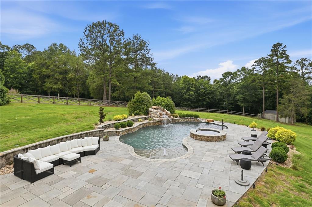 2950 Callie Still Road Lawrenceville, GA 30045 - Photo 48 of 77 a view of swimming pool with lawn chairs and a yard