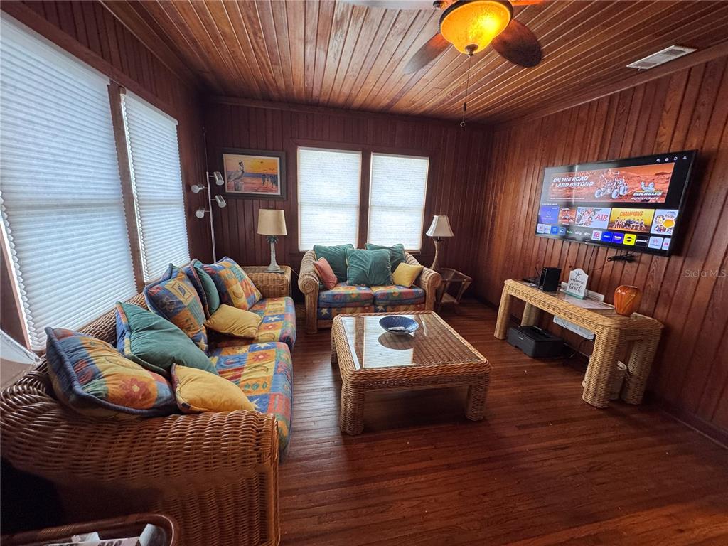 5 82nd Avenue Treasure Island, FL 33706 - Photo 11 of 35 a living room with furniture and a wooden floor