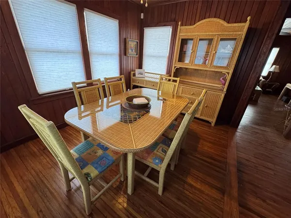 a kitchen with a refrigerator stove and wooden cabinets