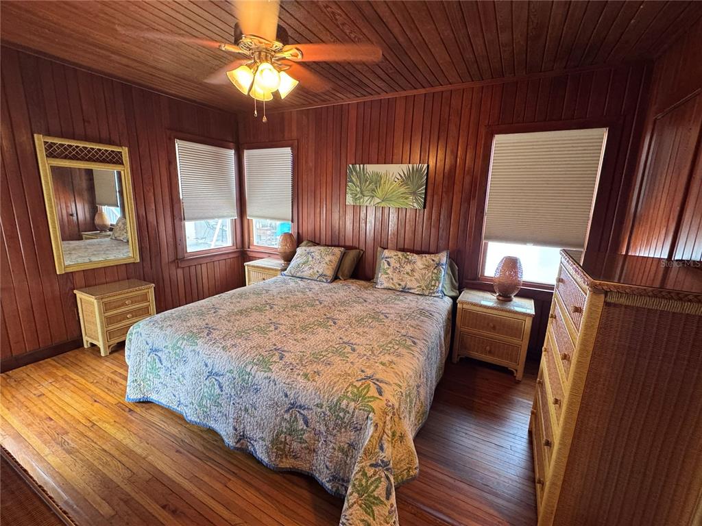 5 82nd Avenue Treasure Island, FL 33706 - Photo 28 of 35 a bed sitting in a bedroom next to a window