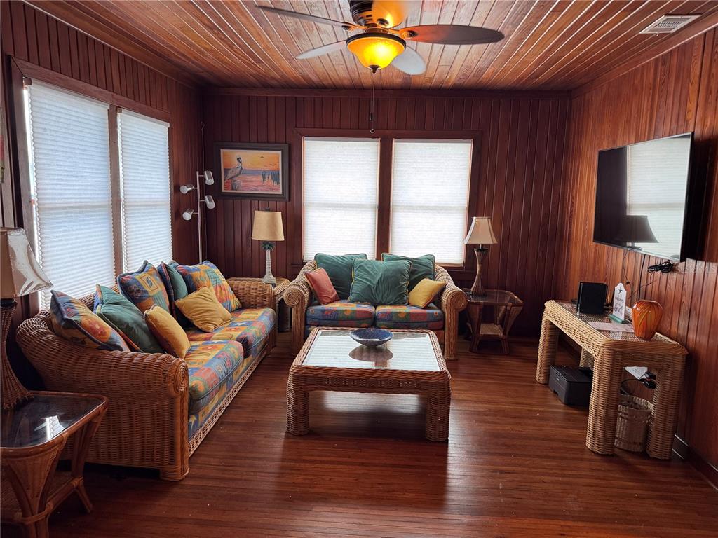 5 82nd Avenue Treasure Island, FL 33706 - Photo 35 of 35 a living room with furniture a ceiling fan and a large window