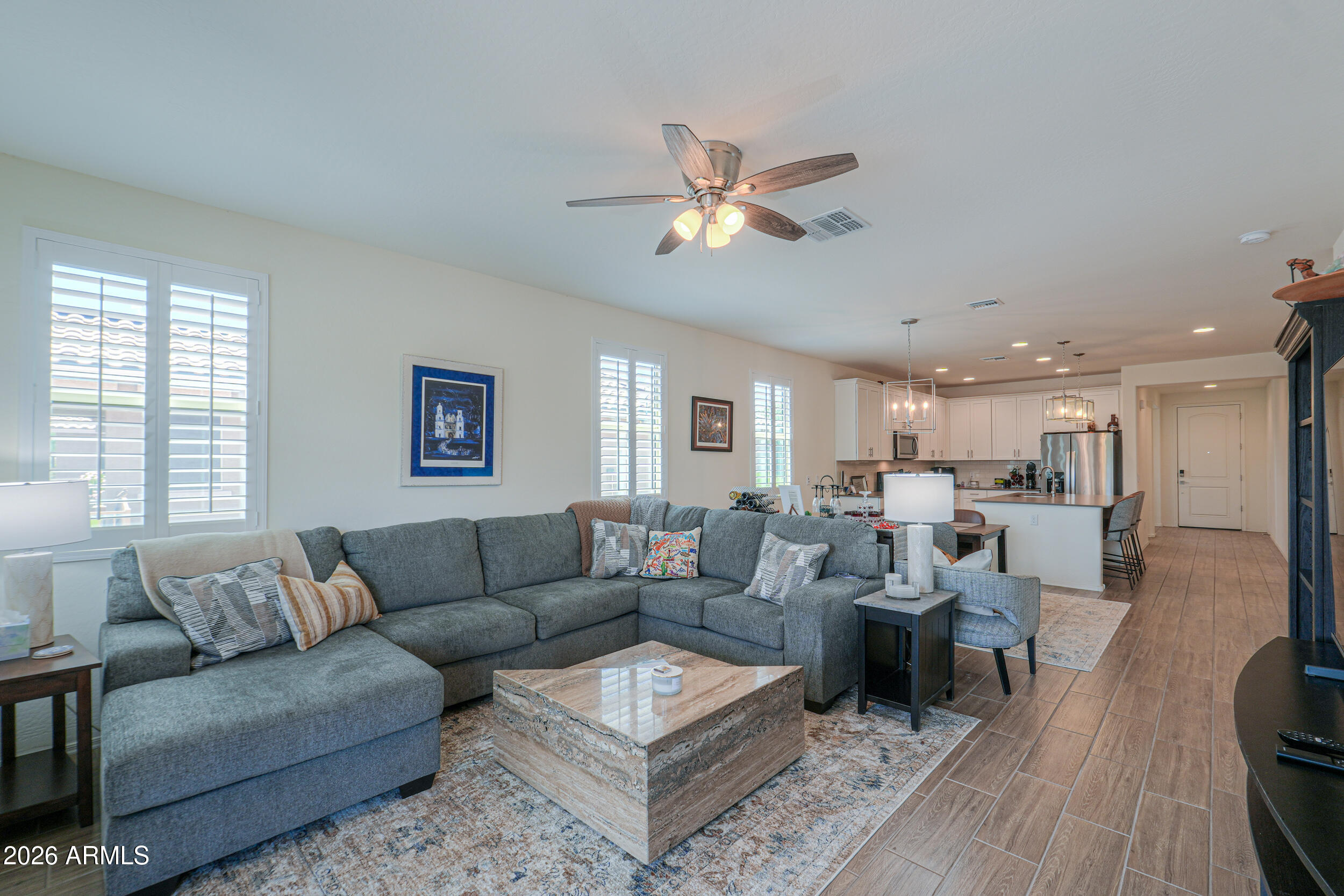 42085 West Cribbage Road Maricopa, AZ 85138 - Photo 14 of 35 a living room with furniture and a wooden floor