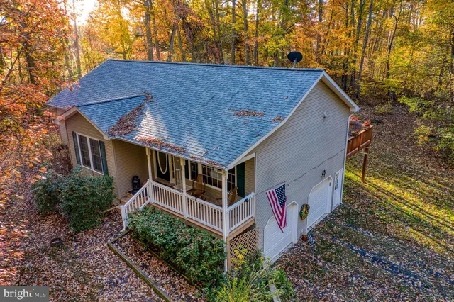 a aerial view of a house with a yard