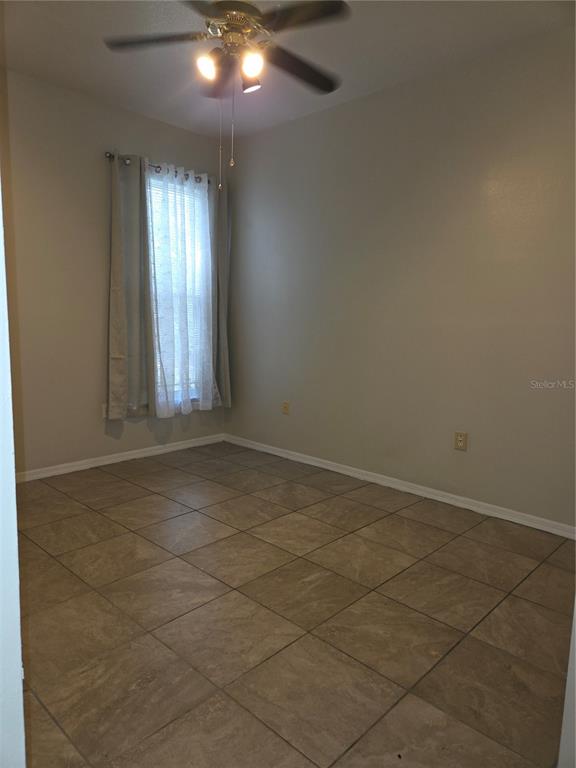4511 Oak River Circle Valrico, FL 33596 - Photo 11 of 14 a view of an empty room and window