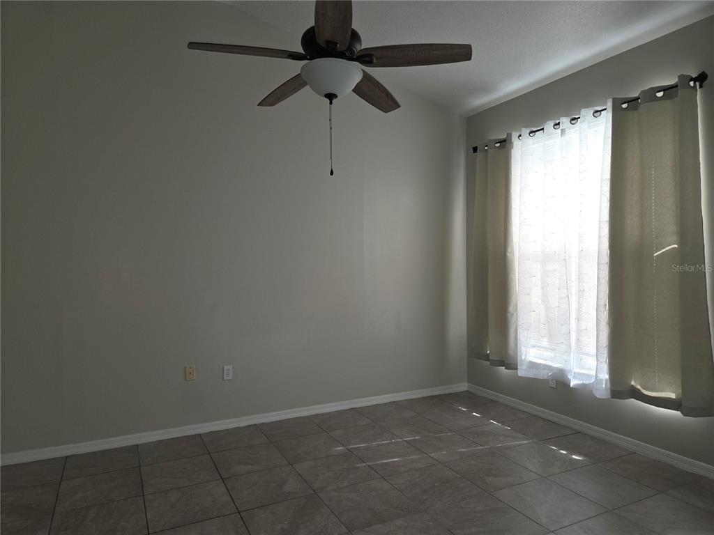 4511 Oak River Circle Valrico, FL 33596 - Photo 13 of 14 a view of an empty room with a window
