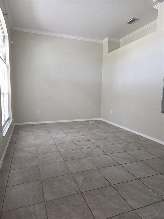 4511 Oak River Circle Valrico, FL 33596 - Photo 2 of 14 a view of an empty room and window