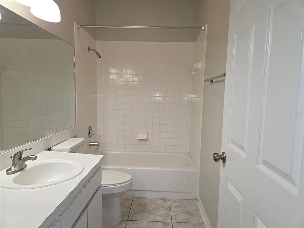 4511 Oak River Circle Valrico, FL 33596 - Photo 7 of 14 a bathroom with a sink a toilet and shower