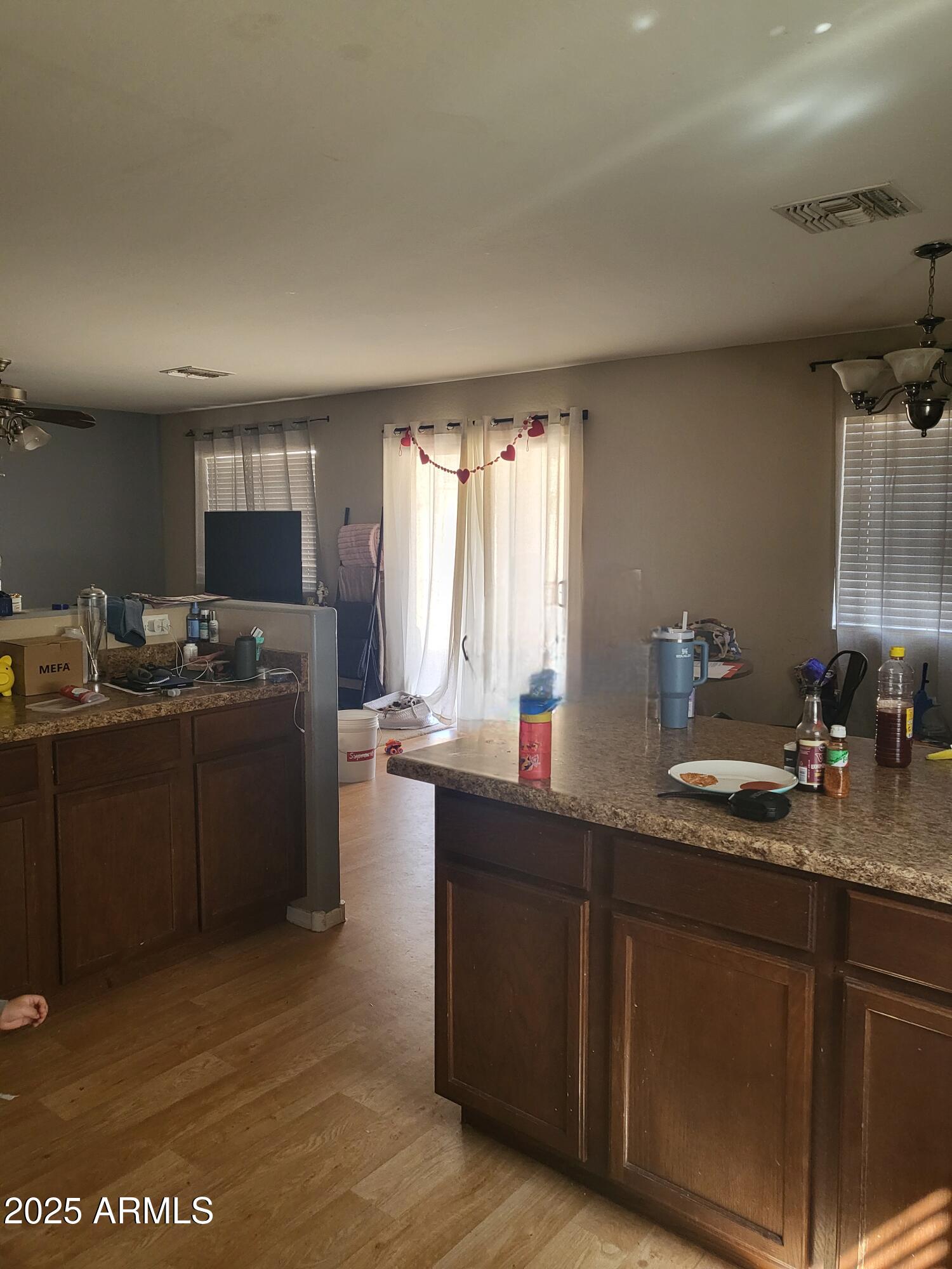 43718 West Magnolia Road Maricopa, AZ 85138 - Photo 11 of 21 a kitchen with a sink cabinets and window