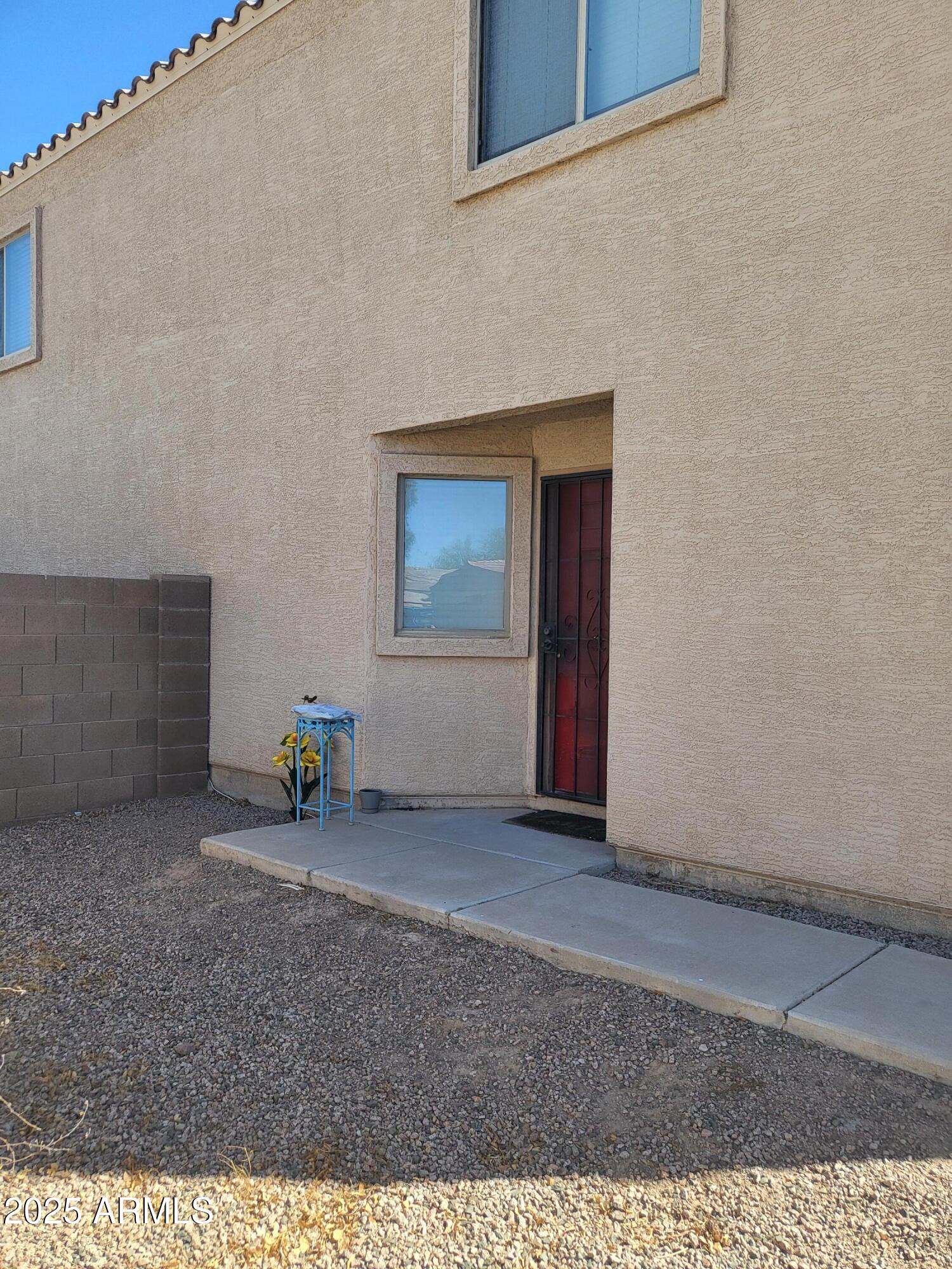 43718 West Magnolia Road Maricopa, AZ 85138 - Photo 3 of 21 a view of an empty room with window