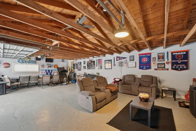 a living room with lots of furniture and a chandelier