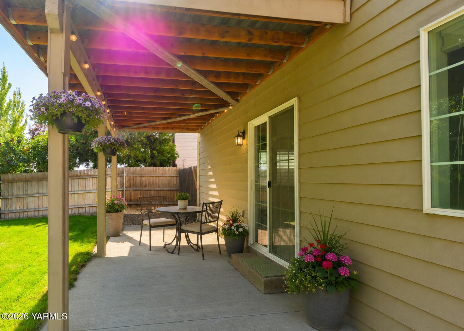 115 Lyle Loop Selah, WA 98942 - Photo 40 of 42 a patio with table and chairs and potted plants
