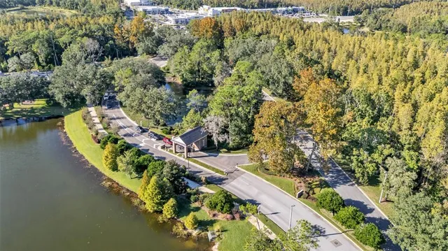 a spacious bedroom with a bed and a flat screen tv