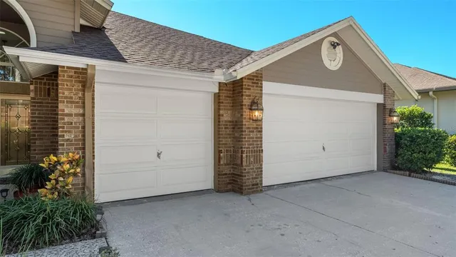 a bedroom with a bed and a ceiling fan