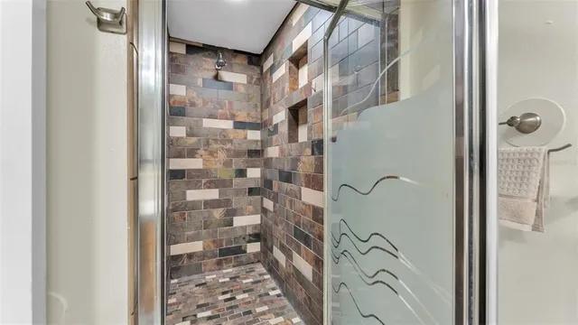 a kitchen with stainless steel appliances granite countertop a refrigerator and a stove