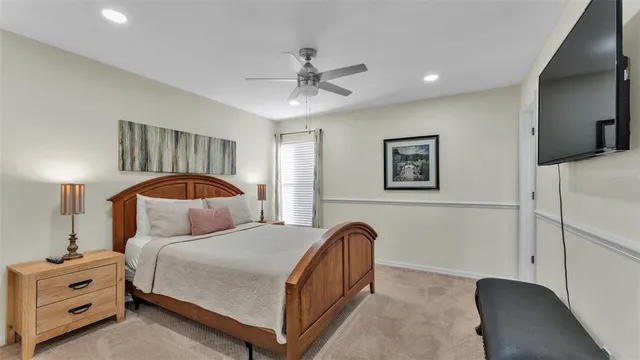 a bedroom with a bed and a mirror