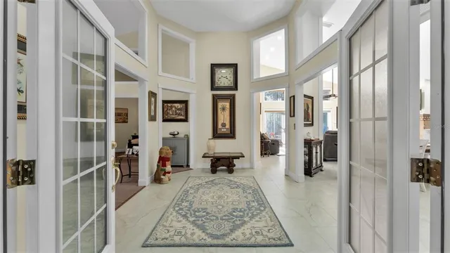a bathroom with a granite countertop toilet sink and mirror