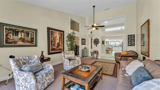 a living room with furniture kitchen and a fireplace