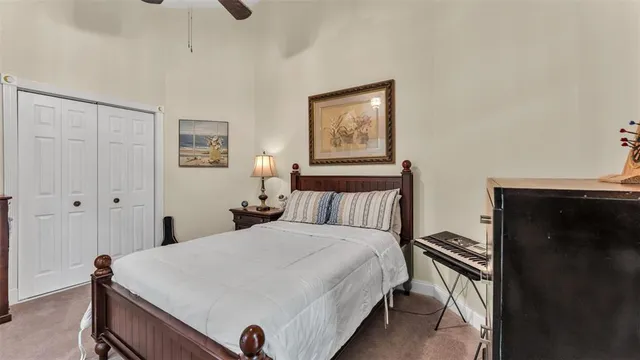 a bedroom with furniture and a flat screen tv
