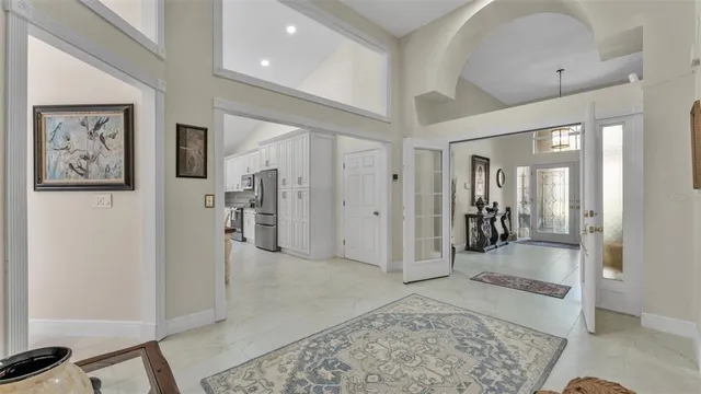 a spacious bathroom with a tub shower and window