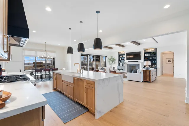 a kitchen with stainless steel appliances granite countertop a stove and a sink