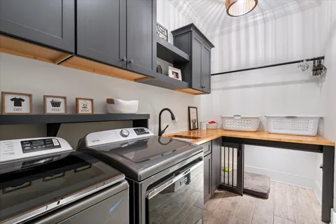 a bathroom with a sink a light fixture and a mirror