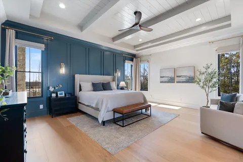 a spacious bedroom with a bed and window