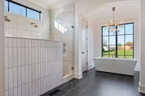 a living room with stainless steel appliances furniture and wooden floor