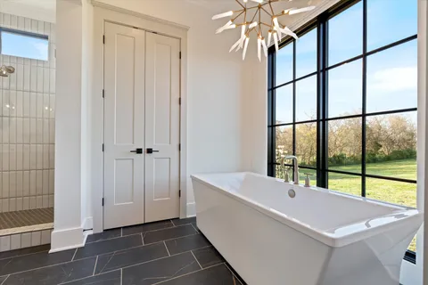 a living room with furniture and a ceiling fan