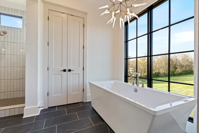 a living room with furniture and a ceiling fan
