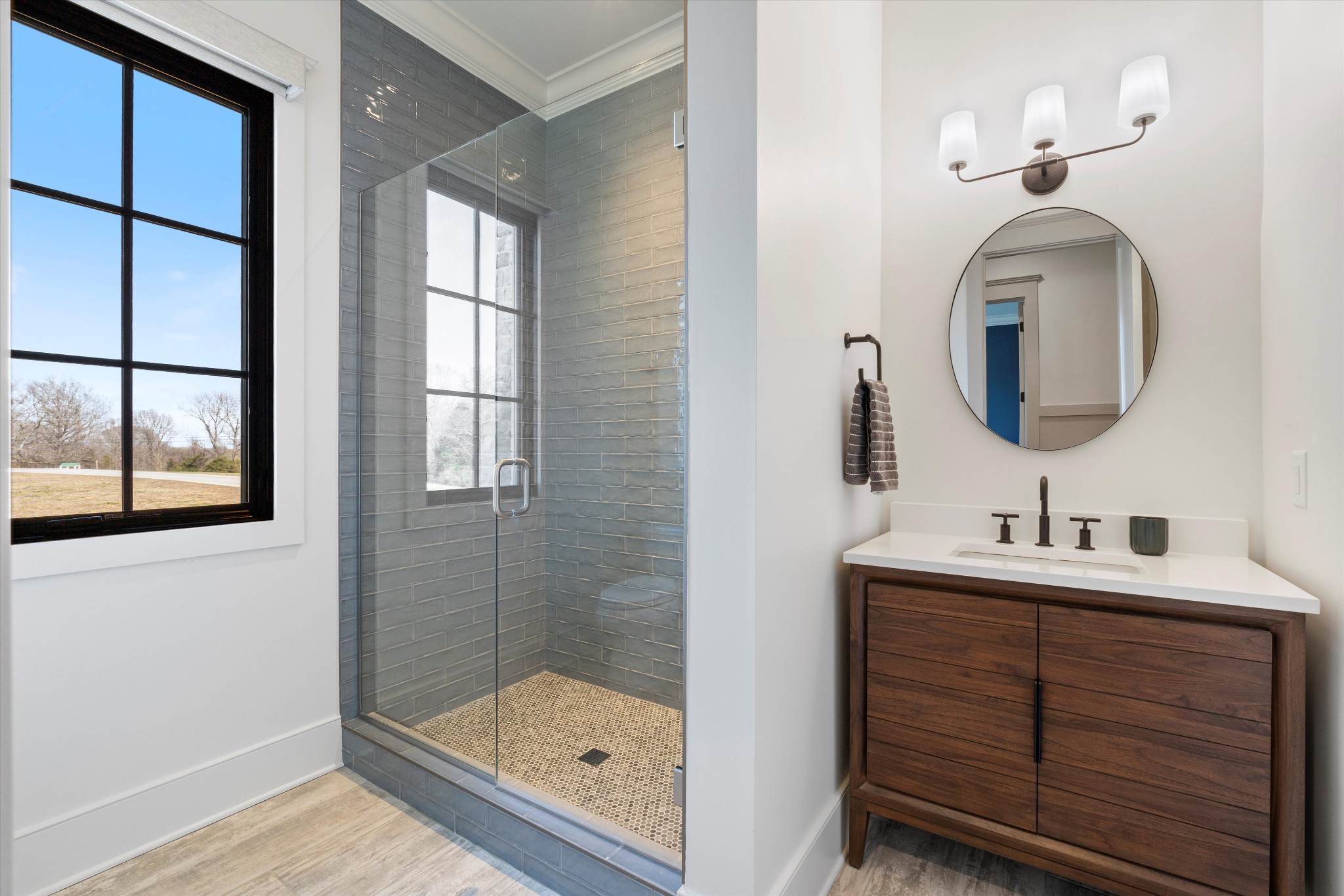 2996 South Rutland Road Mount Juliet, TN 37122 - Photo 36 of 89 a bathroom with a sink a light fixture and a mirror