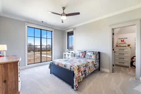 a view of a patio with table and chairs with wooden floor and fence