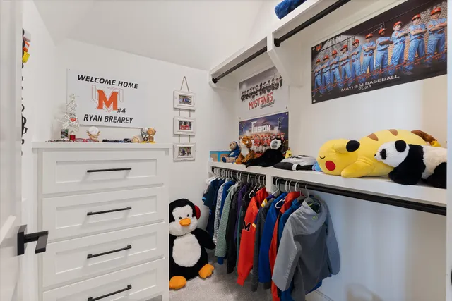 a view of swimming pool with outdoor seating and house in the background