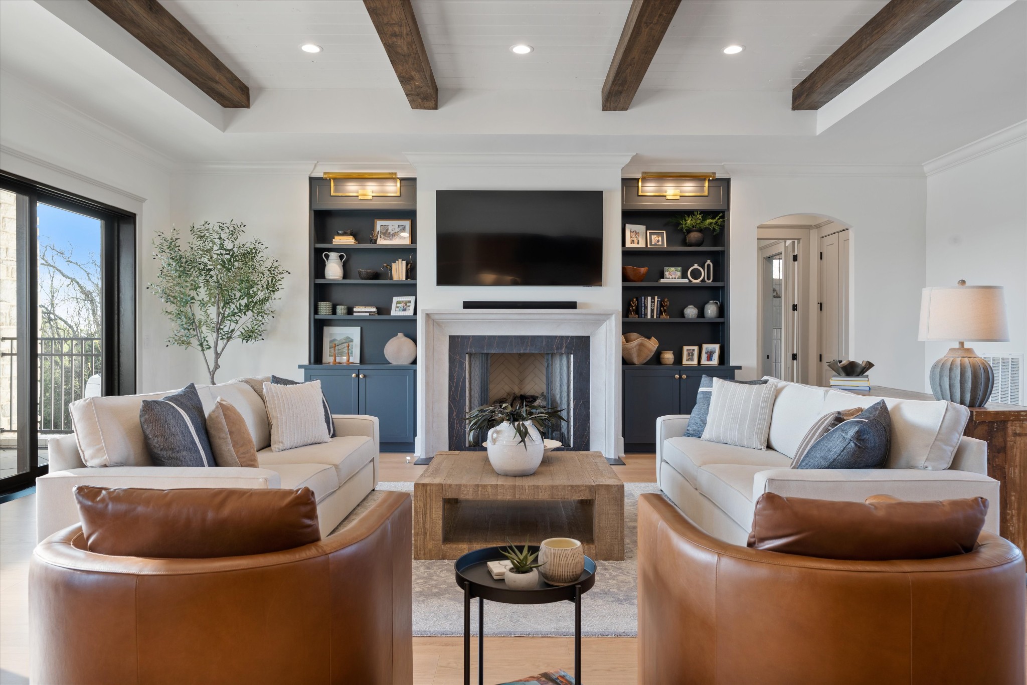 2996 South Rutland Road Mount Juliet, TN 37122 - Photo 9 of 89 a living room with furniture a flat screen tv and a fireplace