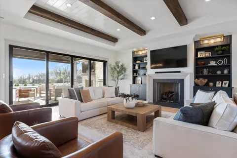 an open kitchen with dining table and chairs
